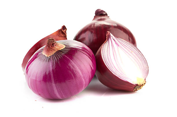 istock Red sliced onion isolated on white background 485629561