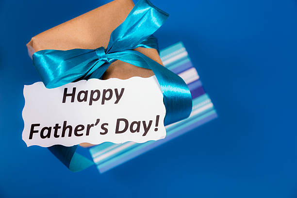 istock Holidays:  Father's Day gift for dad on blue background. 485629847