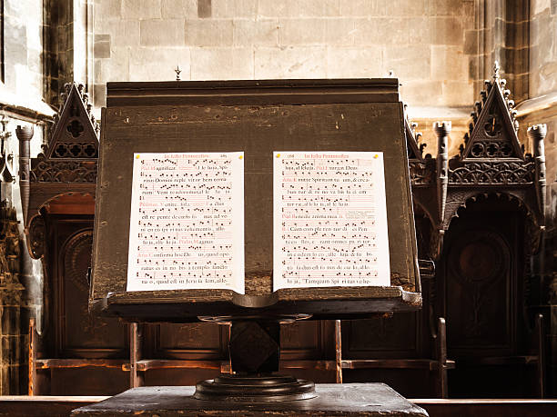 gregorain singing details of a gregorian chant open on a woodemn music stand chanting stock pictures, royalty-free photos & images