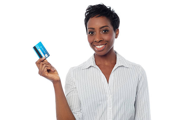 Woman displaying her debit card stock photo