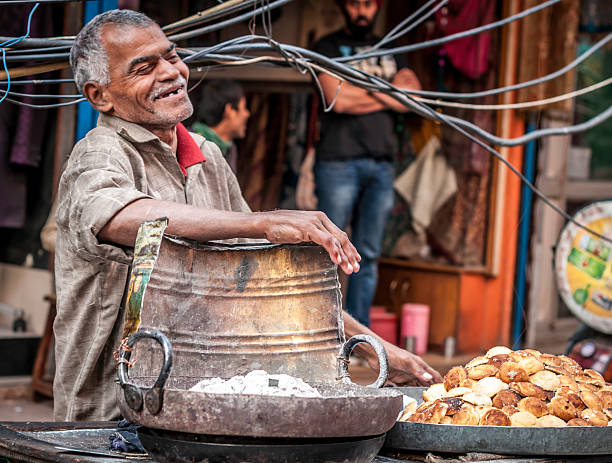 Man having fun at the Old Delhi street market stock photo