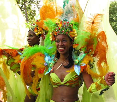 London, UK – August 31, 2009: Performers in elaborate costumes parade through west London at the Notting Hill Carnival, one of the largest street festivals in Europe. The Caribbean-style Carnival is held during two days over the August bank holiday towards the end of every summer. 