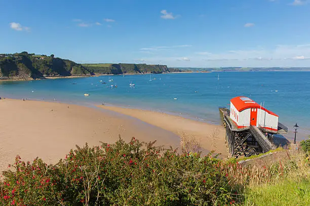 View from Tenby Wales UK of the coast and Carmarthen Bay in summer with old lifeboat station