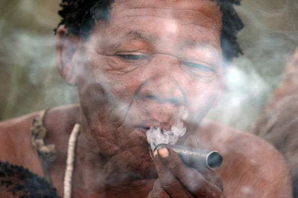 Ghanzi, Botswana - March 24, 2012: An old woman smokes - she is a member of a group of Bushmen of the Kalahari in Botswana.