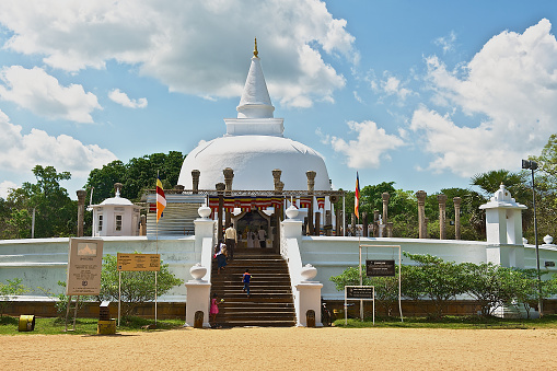 Anuradhapura, Sri Lanka - May 19, 2011: Unidentified people go to Lankarama stupa in Anuradhapura, Sri Lanka.