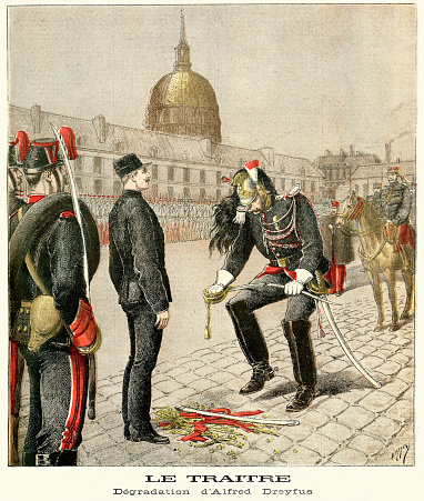 Vintage illustration showing the  Degradation of Alfred Dreyfus, Paris, France. Alfred Dreyfus was a French artillery officer of Jewish background whose trial and conviction in 1894 on charges of treason became one of the most tense political dramas in modern French history. Known today as the Dreyfus Affair. Cashiering (or degradation ceremony) is a ritual dismissal of an individual from some position of responsibility for a breach of discipline. Le Petit Journal, 1895.