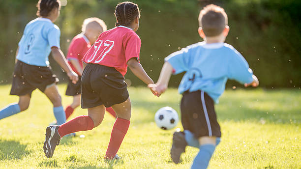 istock Team Chases Soccer Ball 485640210