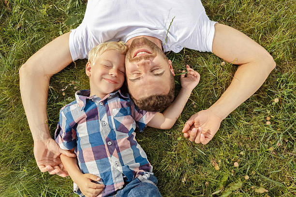 istock Father and son playing on the field 485641956