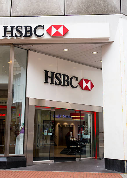 Photograph of the HSBC Branch in Leeds Leeds, UK - July 23, 2015: New style modern HSBC branch in Leeds, which features a range of self-service banking machines. bank entrance stock pictures, royalty-free photos & images