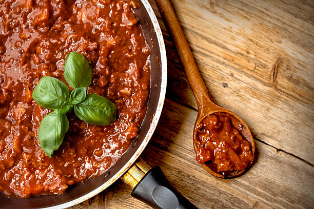Spaghetti Bolognaise Sauce  in the Pot on the wooden table