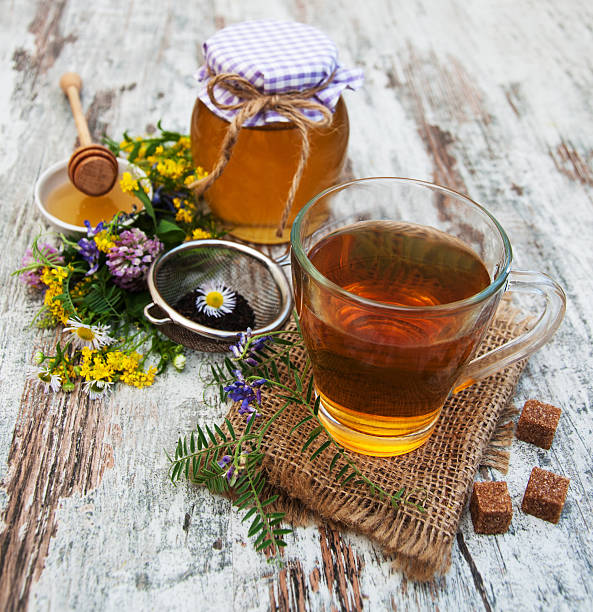 istock Cup of tea, honey and flowers 485646694