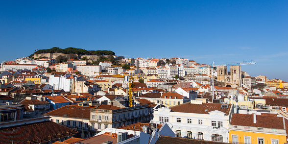Stunning view on Lisbon city with the São Jorge Castle and the surrounding areas of Castelo and Mouraria