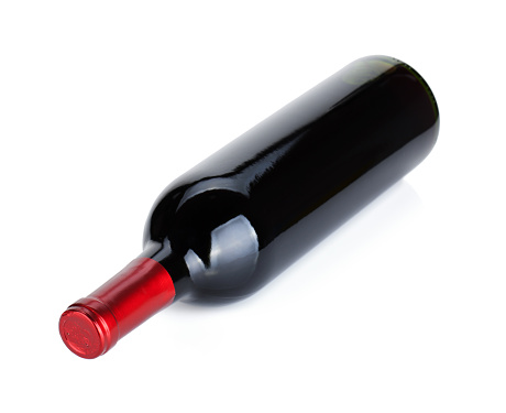 Lying red wine bottle. Isolated on white background