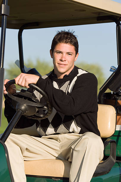 istock Golfer Driving Golf Cart 485649975
