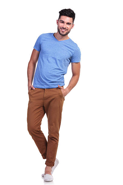 istock casual man standing with hands in pockets and smiles 485650443