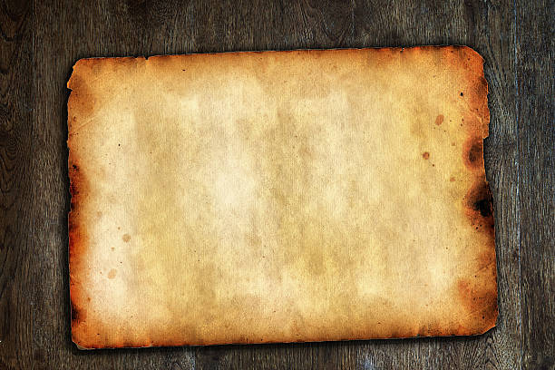 istock Old vintage paper on brown wooden surface with natural texture 485651539