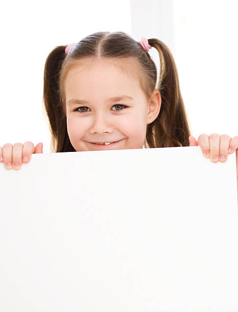 istock Cute girl is holding blank banner 485651769