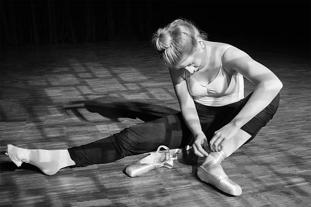 istock Ballerina putting her ballet shoes 485652991