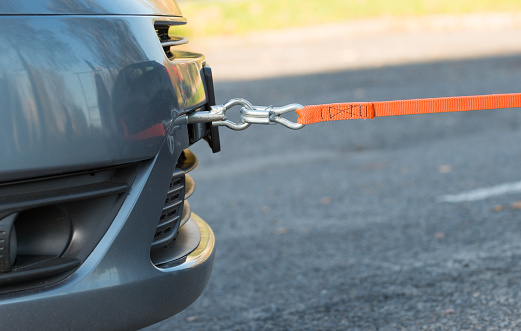Towing hook and tow rope assembled to a broken car
