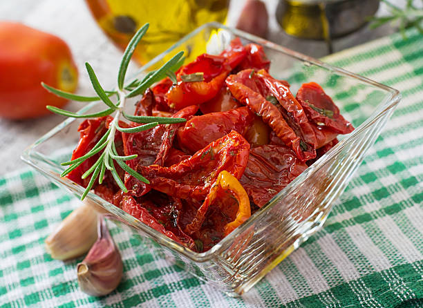 istock Sun-dried tomatoes with herbs and garlic 485653906