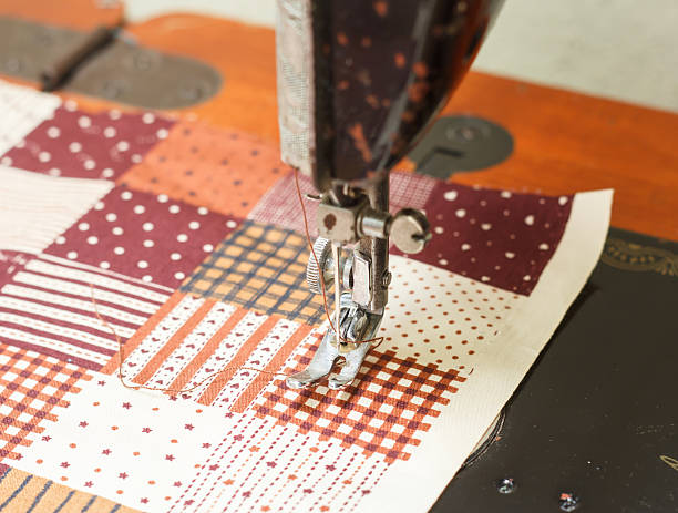 istock sewing machine and item of clothing 485655853