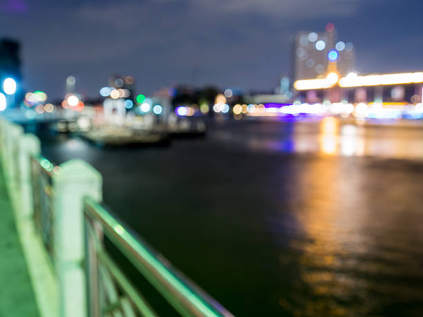 istock Abstract bokeh of  cityscape view along river in night 485656498