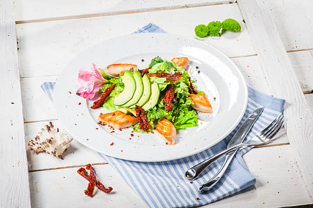 Salad with fried salmon stock photo
