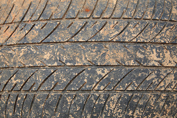 istock Old crack car tire with brown dirt 485657187