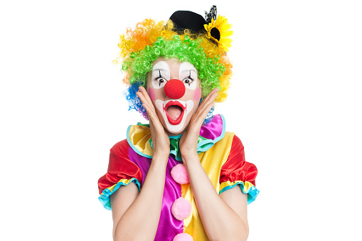 Beautiful young woman as funny clown with balloon dog- colorful portrait