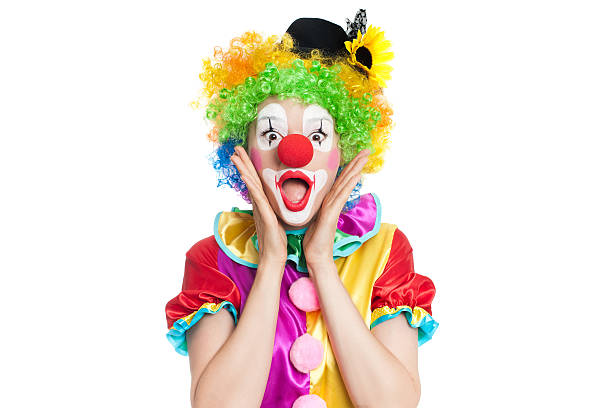Beautiful young woman as colorful clown Beautiful young woman as funny clown with balloon dog- colorful portrait clown photos stock pictures, royalty-free photos & images
