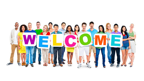 istock Multi-Ethnic Group Of People Holding Cardboards Forming Welcome 485658295