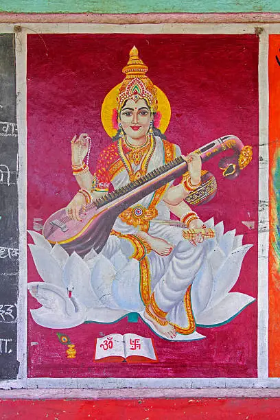 Painting of sarasvati, goddess of speech and eloquence drawing on a slate, India