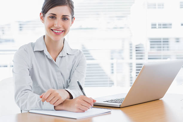 istock Young businesswoman smiling at camera 485670653