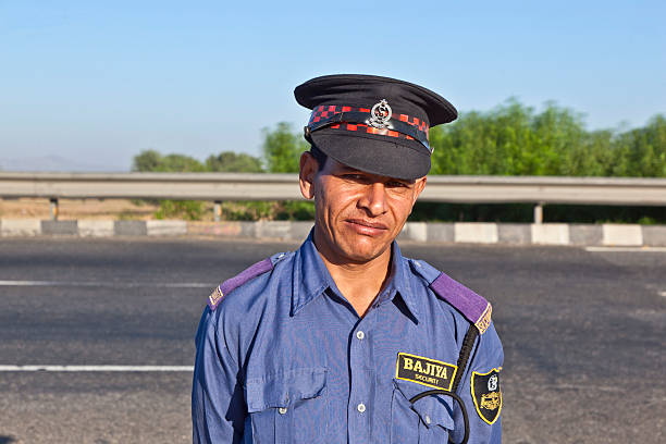 Jaipur, India - November 12, 2011: private guardin uniform protects the parking place and the restaurant at the highway Delhi - JAIPUT in Delhi, India.