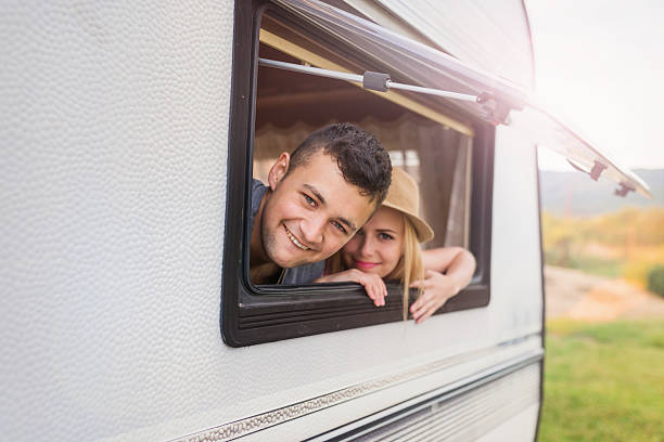 istock Young couple sitting in a camper van 485671498