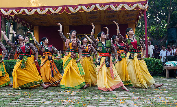 Kolkata, India - March 16, 2014: Unidentified women dancers performing at Holi  /  Spring festival, known as Dol (in Bengali) or Holi (in Hindi) celebrating arrival of Spring in India. A very popular festival, a public event on open space.