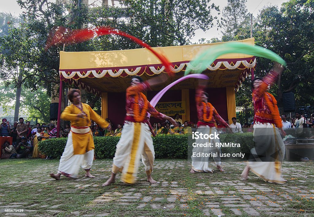 Men dancers performing in Holi celebration, India Kolkata, India - March 16, 2014: Unidentified dancers performing at Holi / Spring festival . A very popular festival in India , known as Dol (in Bengali) or Holi (in Hindi) celebrating arrival of Spring in India. It is a huge public event on open space. Adult Stock Photo