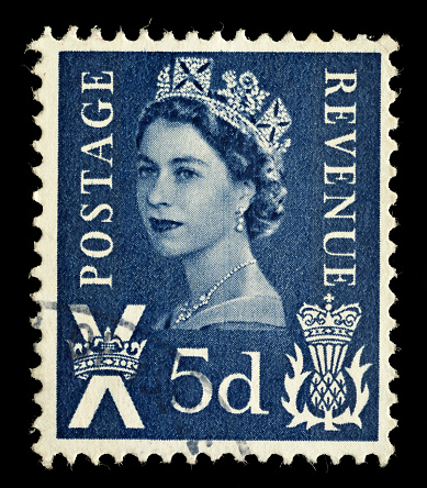 Exeter, United Kingdom - February 17, 2010: A Scottish Used Postage Stamp showing Portrait of Queen Elizabeth 2nd and scottish thistle emblem, printed and issued from 1958 to 1970