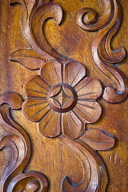 istock flower carved on wood 485676620