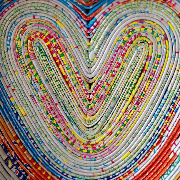 hearts - abstract newspaper macro heart shape стоковые фото и изображения