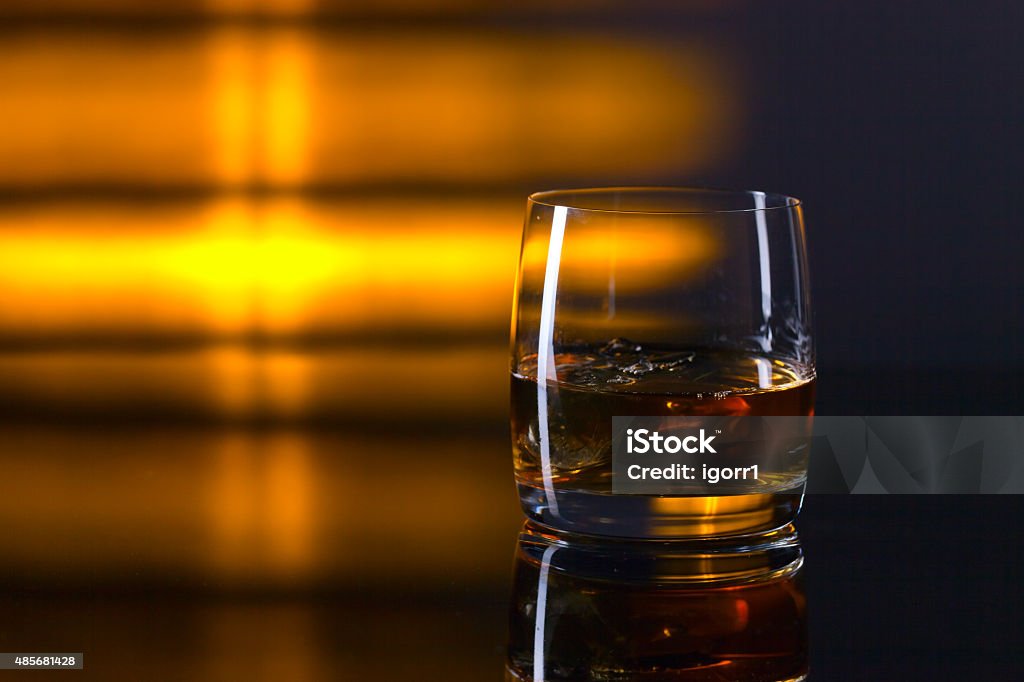 whiskey and ice whiskey and ice on a glass table 2015 Stock Photo