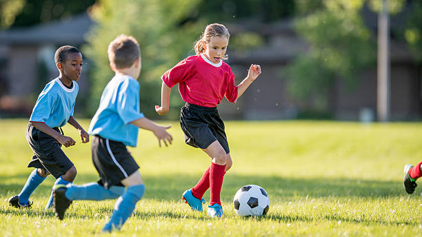 Girl Dribbling a Soccer Ball