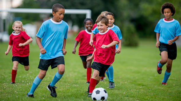 istock Soccer Players Kicking the Ball 485681756