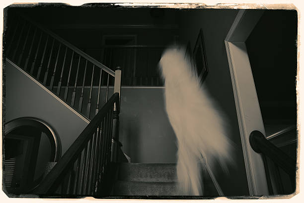 Spirit Photography An old antique photograph of a staircase with a spirit caught on film. horror photos stock pictures, royalty-free photos & images