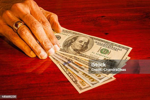 Dollars Usa Currency Money On Polished Rosewood Table Stock Photo - Download Image Now