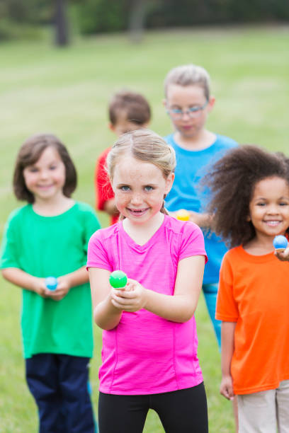 istock Multiracial group of children in an egg spoon race 485687402