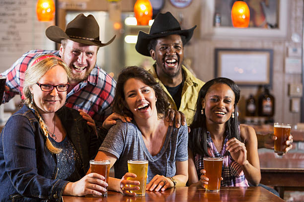 istock Group of friends drinking beer in a restaurant bar 485687404