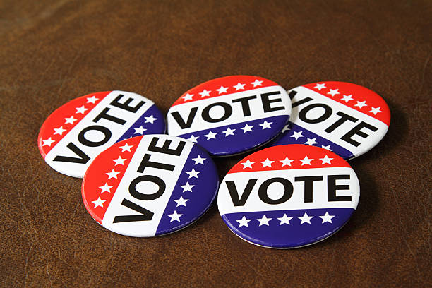 istock Vote buttons or pins on a dark background 485687418