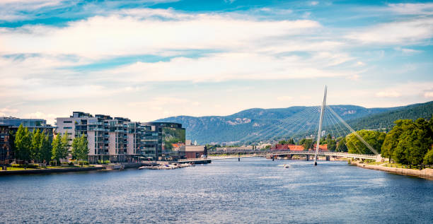 Seaside river of Drammen, Norway Drammenselva river. "Ypsilon" Cable-stayed bridge. Modern apartment area. østfold stock pictures, royalty-free photos & images