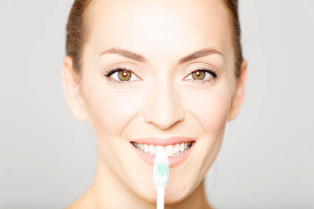 istock Beautiful woman holding a toothbrush 485687898